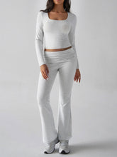 Model walking forward in Light Gray Liahnique set showing movement and fit