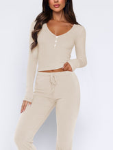 Close-up of buttons and tie waist on Lunavena beige top