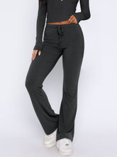 Close-up of bootcut pants detail on Lunavena dark gray set