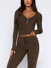 Close-up of buttons and tie waist on Lunavena olive brown top”