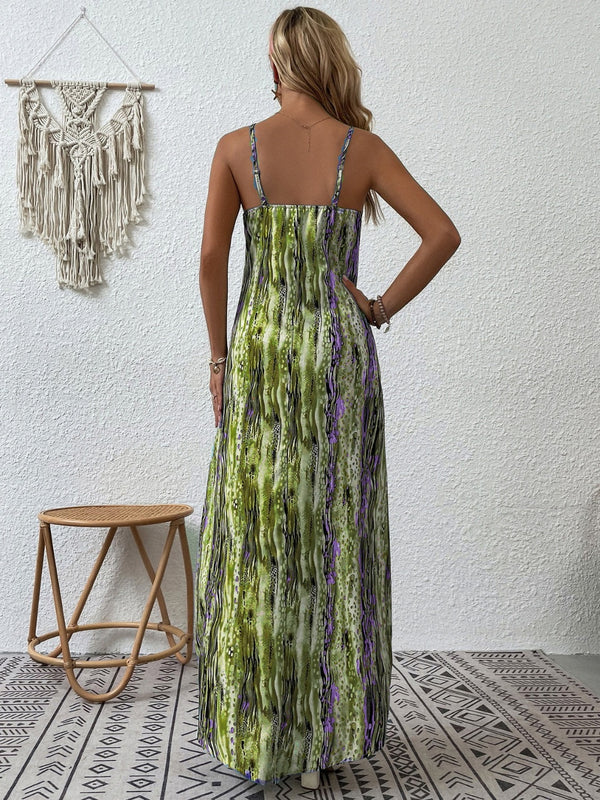 Back shot photo of a model posing in the Lime color Jewel of Northern Lights Maxi Cami Dress paired with jewlery and heels highlighting the adjustable spaghetti straps.
