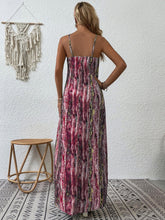 Back shot photo of a model posing in the burgundy color Jewel of Northern Lights Maxi Cami Dress paired with jewlery