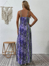 Back shot photo of feminine posing in the electric purple color Jewel of Northern Lights Maxi Cami Dress paired with accessories in Los Angeles.
