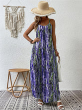 Model posing in the Electric Purple color Jewel of Northern Lights Maxi Cami Dress paired with a woven straw hat with white raw trim, jewelry, a white handbag with wooden round strap, and white heels