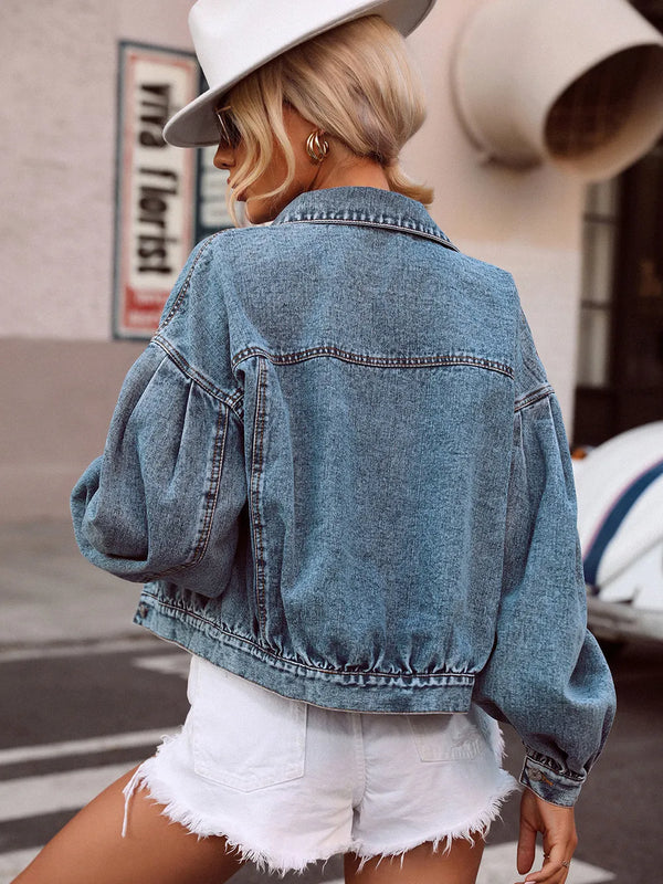 Back view of medium-wash collared denim top featuring dropped shoulders and relaxed, easy fit.