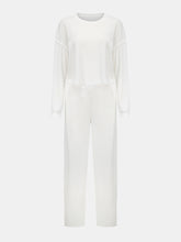 Front flat lay of Mellara rich white cropped top and wide-leg pants