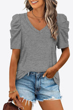 Mid gray puff sleeve V-neck tee styled with joggers for a casual, chic vibe, featuring light volume at the shoulders.
