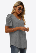 Side shot of mid gray puff sleeve tee showcasing the rounded puff sleeve and soft stretch fabric.