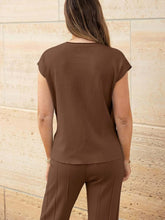 Close-up of knit texture and cap sleeve seams on Mirajella Luxe brown top rear