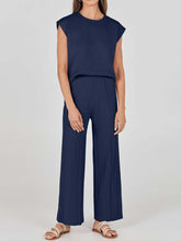 Mirajella Luxe Pleated Knit Set in dark blue styled with sandals and hoop earrings for a laid-back lounge look