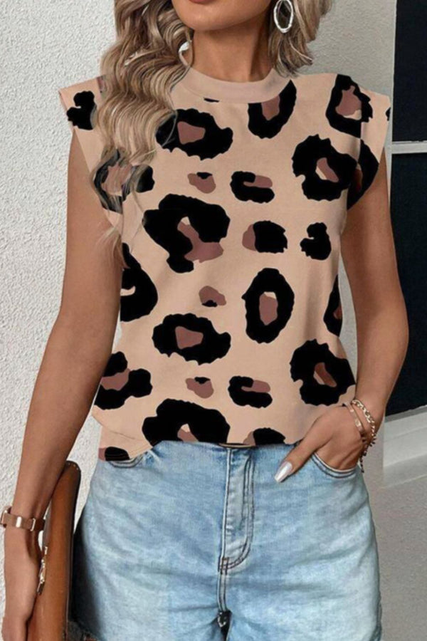 Model wearing a Mocha leopard print round neck cap sleeve T-shirt paired with black distressed jeans and hoop earrings for a bold casual look.