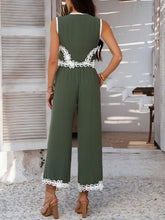 Back view of model wearing Moss Xyvello vest and pants set