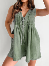 Moss green romper styled with neutral heels and botanical earrings—rooted, grounded, and effortlessly stylish.