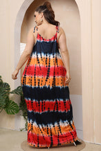Model back shot photo of the Ombravelle multicolor Tie-Dye Dream Maxi Dress highlighting the tie shoulder and vibrant color fabric.