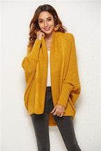Front view of woman modeling Mustard SeraphinaWing Open Front Cardigan, showing open neckline and airy sleeves.