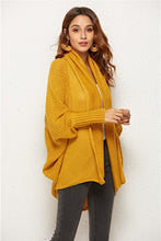 Side view of woman in Mustard SeraphinaWing Cardigan, sleeves relaxed with flowing side hem.