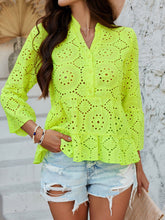 Model in Neon Yellow Luméa™ Blouse, paired with a skirt and brown straw handbag for an evening event.