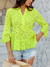 Model wearing Luméa™ Blouse in Neon Yellow, paired with distressed shorts and sandals at a summer beach party.