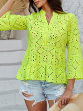 Side view of Luméa™ Blouse in Neon Yellow, styled with a tan ruffled handbag and sneakers for a casual outing.