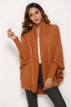 Woman wearing Ochre SeraphinaWing Open Front Cardigan, front view with wide batwing sleeves.