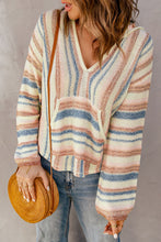 Front view of a woman wearing the Ollavon™ Striped Hoodie, featuring vibrant multicolor stripes, a cozy kangaroo pocket, and hood with a relaxed fit.