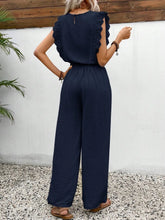 Back view of the Dark Blue Papiloniya™ wide-leg pants, showcasing the elastic waistband, side pockets, round neck back button closure, and delicate lace ruffled cap sleeve trim detailing.