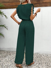 Close-up of the dark green Papiloniya™ Lace Trim Round Neck Top showing delicate lace trim on the neckline and ruffled cap sleeves, with a back button closure.