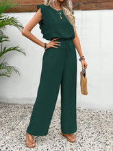 Model posing in dark green Papiloniya™ Lace Trim Top and Pants Set, styled with jewelry and heels, perfect for a casual outing or evening event.