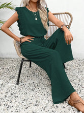 Model posing in dark green Papiloniya™ Lace Trim Top and Pants Set, styled with jewelry and heels, perfect for a casual outing or evening event.