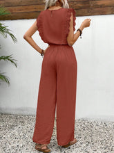 Back view of the Terracotta Papiloniya™ wide-leg pants, showcasing the elastic waistband, side pockets, round neck back button closure, and delicate lace ruffled cap sleeve trim detailing.