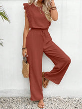 Model posing in Terracotta Papiloniya™ Lace Trim Top and Pants Set, styled with jewelry and sandals at a resort.