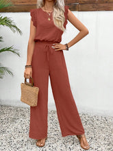 Lifestyle shot of the Terracotta Papiloniya™ Lace Trim Set worn for an outdoor cookout, paired with loafers, a tan handbag, and gold jewelry.
