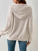 Back view of the Calvessa Hoodie in pastel yellow, showing the relaxed fit, dropped shoulders, and ribbed fabric texture.