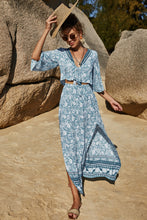 Full body image of woman in PetalVista misty blue set styled with heels and accessories