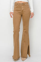 Close-up of side slit and premium stretch denim texture