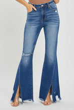 Front view of RISEN High Rise Flare Jeans with front slit and frayed hem