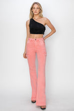 Model styled in RISEN side slit jeans with heels and fitted top