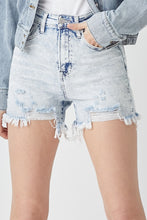 Close-up of RISEN Raw Hem High Rise Shorts’ distressed details and frayed hem, capturing its effortless edgy style.