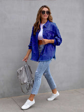 Front view of model wearing a royal blue CloudKitten Distressed Drop Shoulder Denim Jacket, with button closure, relaxed shoulders, and chest pockets.