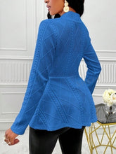 A woman showcasing the back of a white One Button Textured Peplum Cardigan shopping in Berlin.