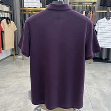 TexturaLoom Men’s Embossed Letter Polo Purple Back View on Hanger.