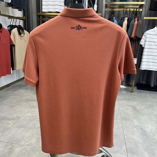 TexturaLoom Men’s Embossed Letter Polo Orange Back View on Hanger.