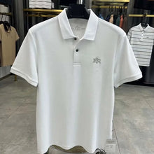 TexturaLoom Men’s Embossed Letter Polo White Front View on Hanger.