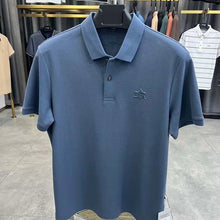 TexturaLoom Men’s Embossed Letter Polo Blue Front View on Hanger.