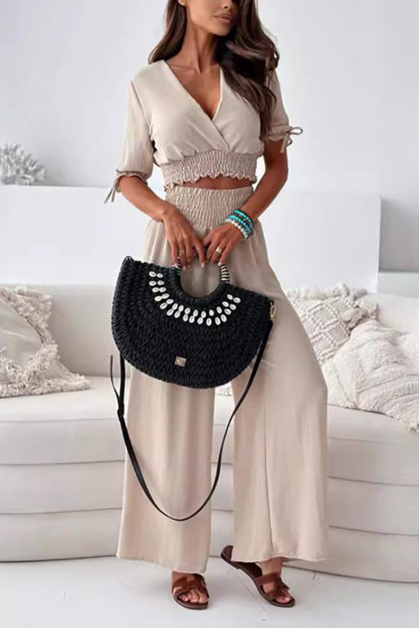 Seerophant Ruffle Lounge Duo in dust storm front view styled at tropical mansion