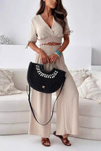 Seerophant Ruffle Lounge Duo in dust storm front view styled at tropical mansion