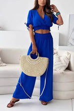 Seerophant Ruffle Lounge Duo in royal blue front view styled at tropical mansion