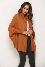Woman wearing Ochre SeraphinaWing Cardigan, side profile with sleeve drape and open layering.