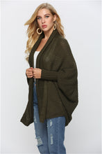 Side view of woman in Army Green SeraphinaWing Cardigan, showing sleeve movement and side hem fall.