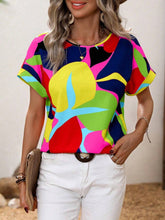 Side angle of the canary yellow contrast trim blouse highlighting the round neckline and airy short sleeves, paired with minimal accessories.